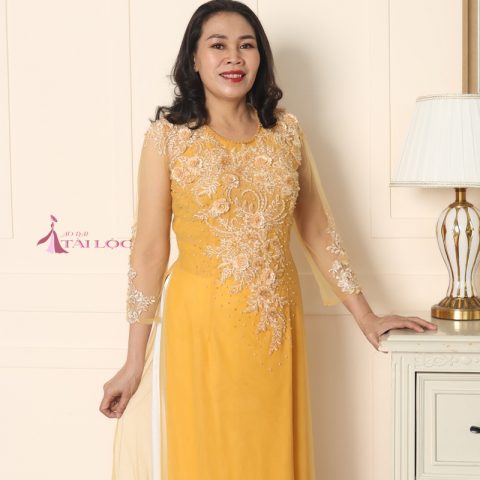 Áo dài mẹ cô dâu vải ren màu vàng ( Ms